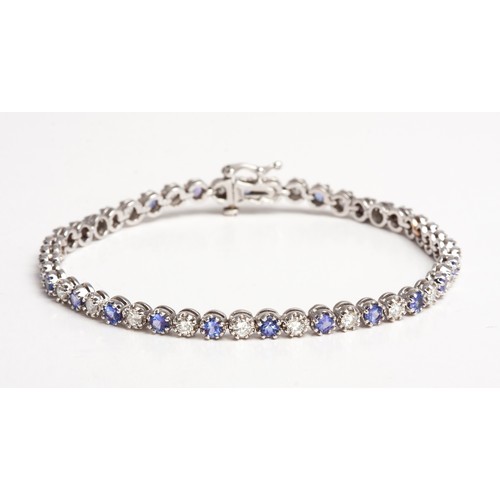 387 - A DIAMOND AND TANZANITE BRACELET