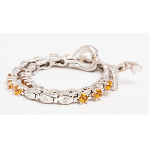 384 - A DIAMOND AND CITRINE TENNIS BRACELET