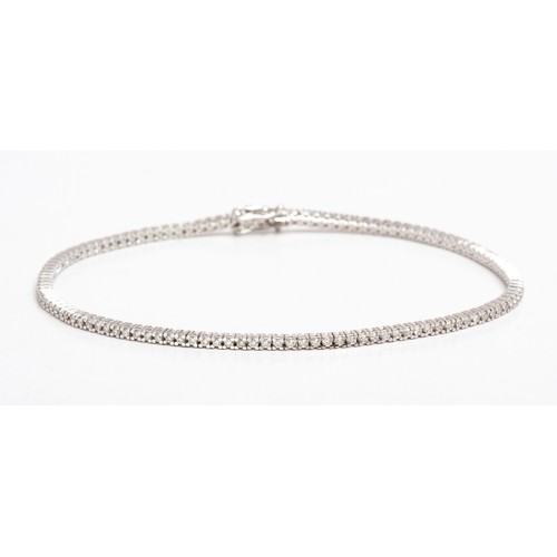 388 - A DIAMOND TENNIS BRACELET