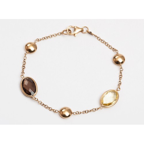 408 - A GOLD AND GEMSTONE BRACELET