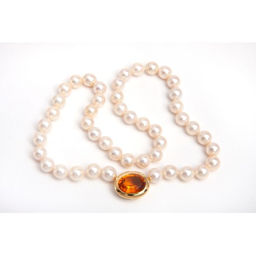 73 - A CULTURED PEARL AND GEMSTONE NECKLACE