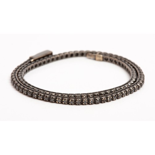 405 - A DIAMOND TENNIS BRACELET