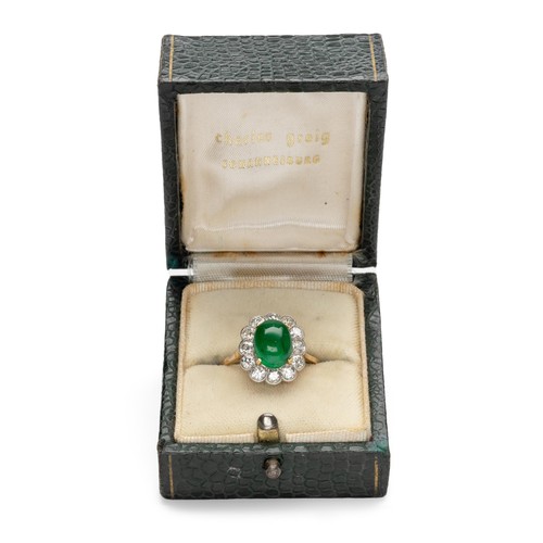 1003 - AN EMERALD AND DIAMOND RING