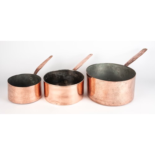 209 - A SET OF THREE TIN-LINED COPPER SAUCEPANS