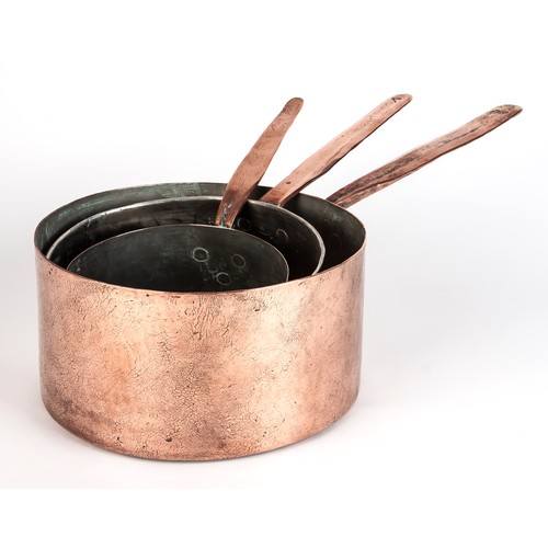 209 - A SET OF THREE TIN-LINED COPPER SAUCEPANS