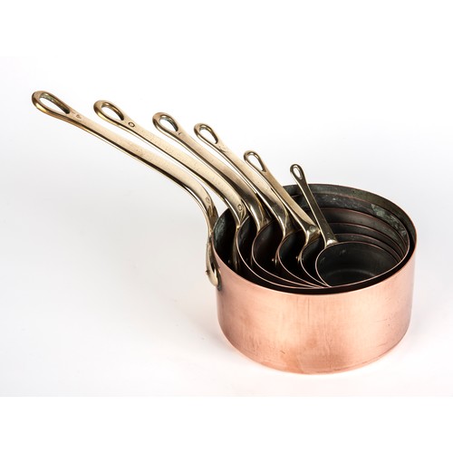 208 - A SET OF SIX TIN-LINED COPPER SAUCEPANS WITH BRASS HANDLES