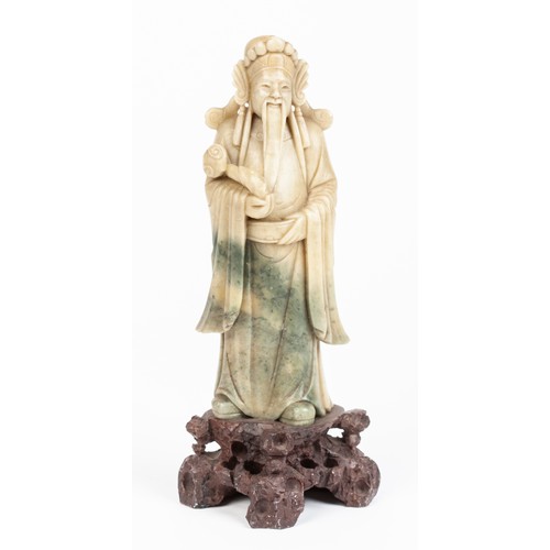 481 - A CHINESE SOAPSTONE FIGURE OF AN IMMORTAL, REPUBLIC OF CHINA, 1949 -