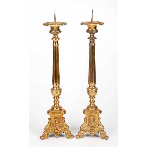 204 - A PAIR OF BRASS ALTAR CANDLESTICKS