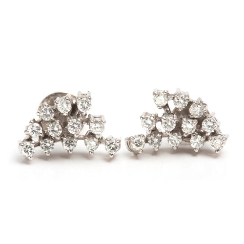 1100 - A PAIR OF DIAMOND CLUSTER EARRINGS