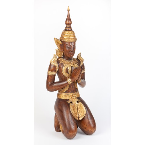 484 - A SOUTH EAST ASIAN GILT-WOOD CARVING OF A DEITY