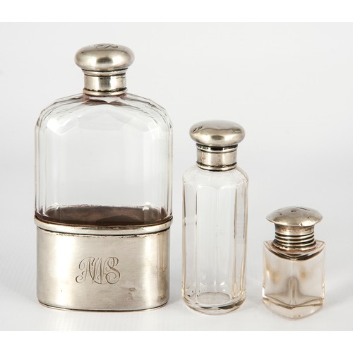 132 - SILVER AND GLASS FLASK AND TWO SILVER-MOUNTED DRESSING TABLE BOTTLES