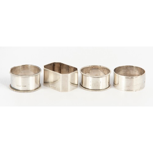 130 - FOUR SILVER NAPKIN RINGS