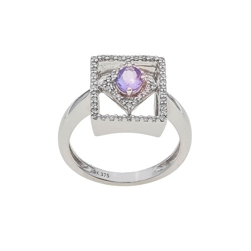 1116 - A TANZANITE AND DIAMOND DRESS RING