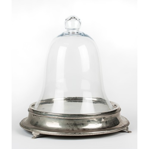 59 - A SILVER PLATED CIRCULAR CAKE STAND AND GLASS CLOCHE