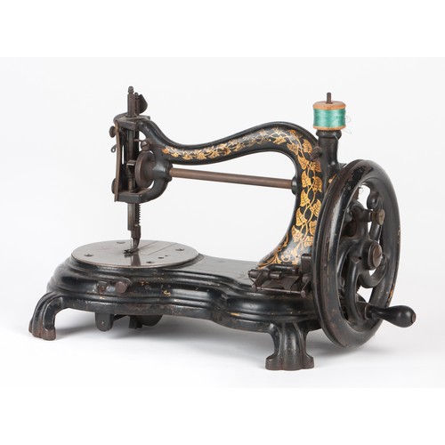 26 - A BLACK CAST IRON SEWING MACHINE