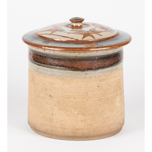 38 - A STONEWARE JAR AND COVER