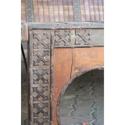 184 - AN INDIAN WOOD AND METAL-MOUNTED BED