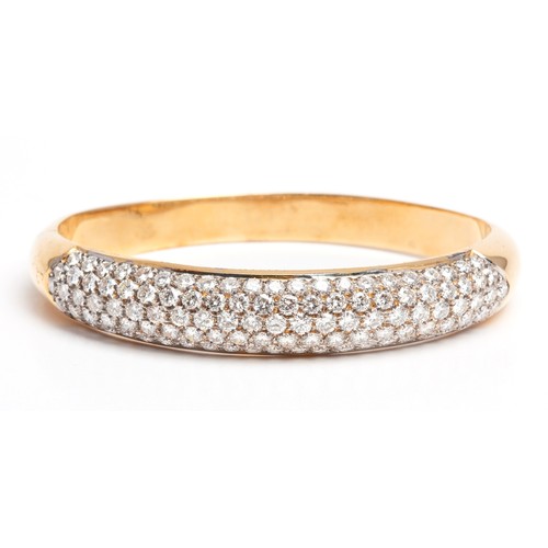 163 - A GOLD AND DIAMOND BANGLE, CIRCA 1960