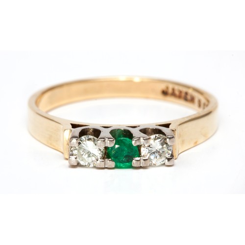 253 - A DIAMOND AND EMERALD ETERNITY RING