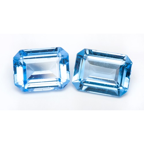 309 - A PAIR OF BLUE TOPAZ GEMSTONES