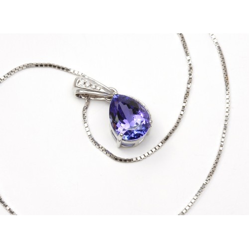 180 - A TANZANITE AND DIAMOND PENDANT