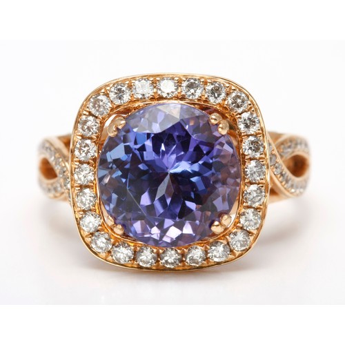 183 - A TANZANITE AND DIAMOND DRESS RING