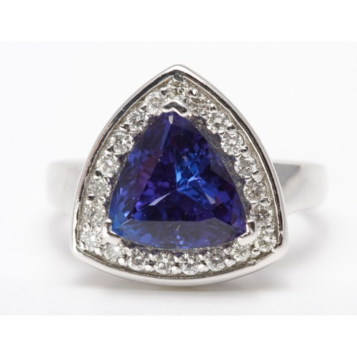 184 - A TANZANITE AND DIAMOND DRESS RING