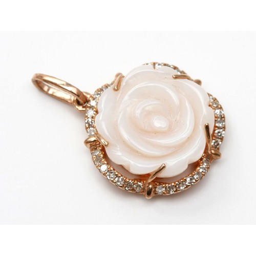 195 - A ROSE SHELL AND DIAMOND PENDANT