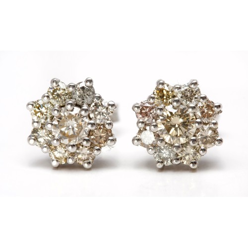 215 - A PAIR OF DIAMOND EARRINGS