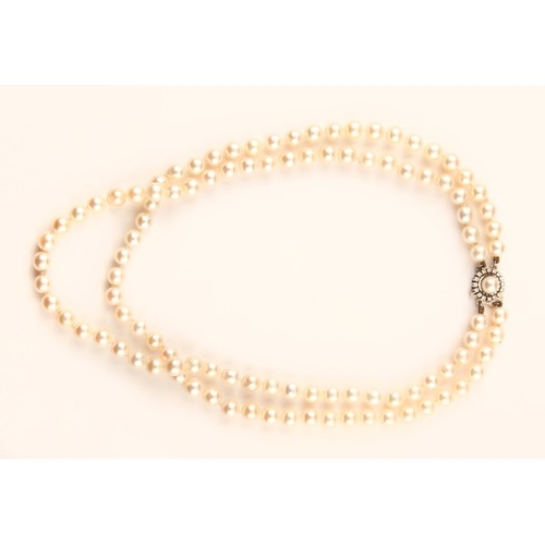 231 - A PEARL AND DIAMOND NECKLACE