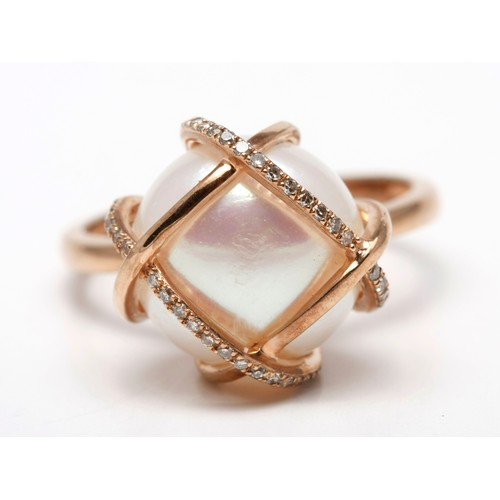 235 - A DIAMOND AND PEARL RING