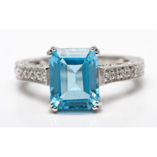 261 - A TOPAZ AND DIAMOND DRESS RING