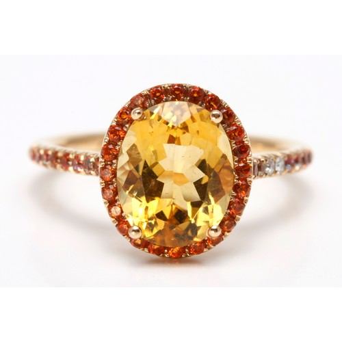 262 - A TOPAZ, CITRINE AND DIAMOND DRESS RING