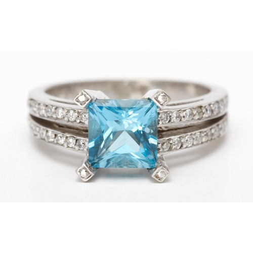 265 - A TOPAZ AND DIAMOND DRESS RING