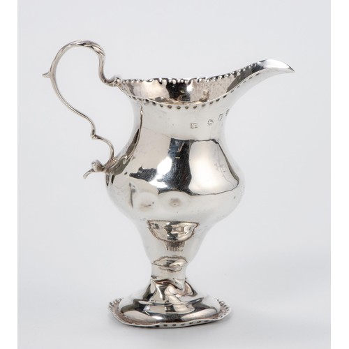 1014 - A GEORGE III SILVER MILK JUG, MAKERS MARKS RUBBED, LONDON, 1780