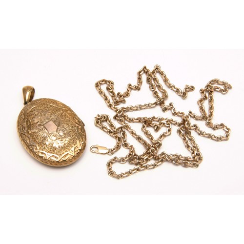 299 - A GOLD CHAIN WITH METAL CORE LOCKET