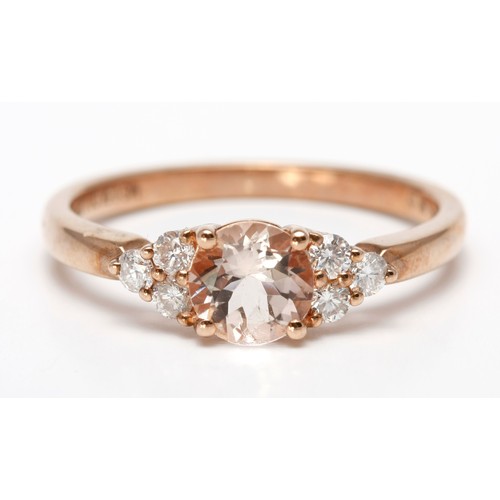 187 - A MORGANITE AND DIAMOND DRESS RING