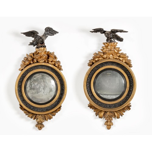 327 - A PAIR OF REGENCY EBONISED AND GILTWOOD CONVEX MIRRORS