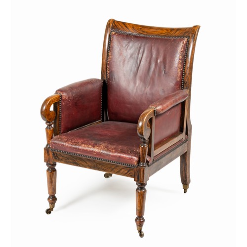 112 - A ROSEWOOD AND LEATHER UPHOLSTERED LIBRARY CHAIR, 19TH CENTURY