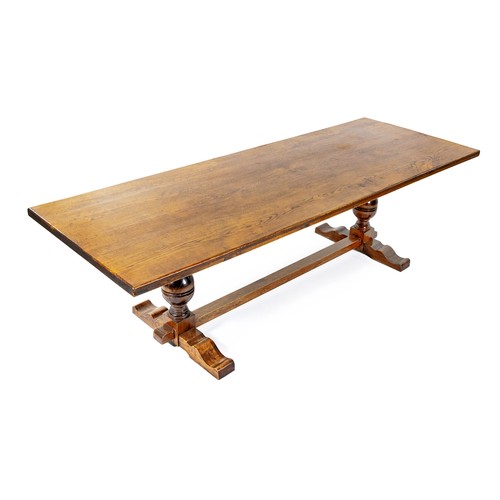 125 - AN OAK REFECTORY  STYLE TABLE