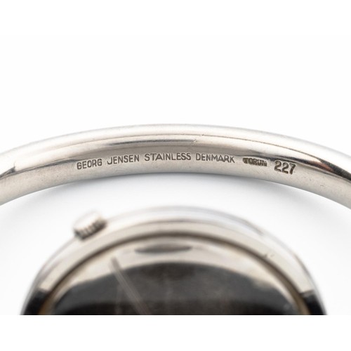 176 - A STAINLESS-STEEL BANGLE WRISTWATCH, DESIGNED BY VIVIANNA TORUN BÜLOW-HÜBE FOR GEORG JENSEN