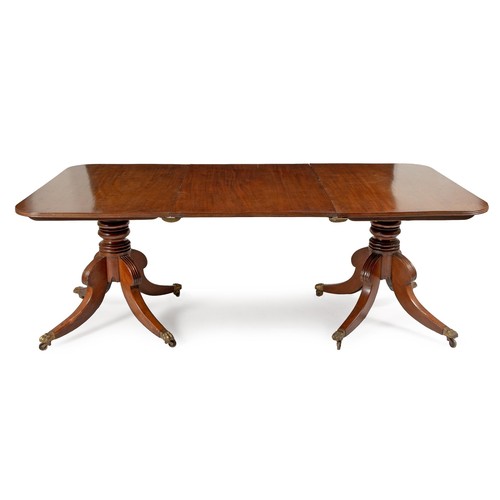 339 - A REGENCY MAHOGANY EXTENDING DINING TABLE, RETAILED BY NORMAN ADAMS, LONDON