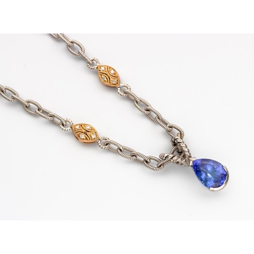 472 - A TANZANITE AND DIAMOND PENDANT NECKLACE