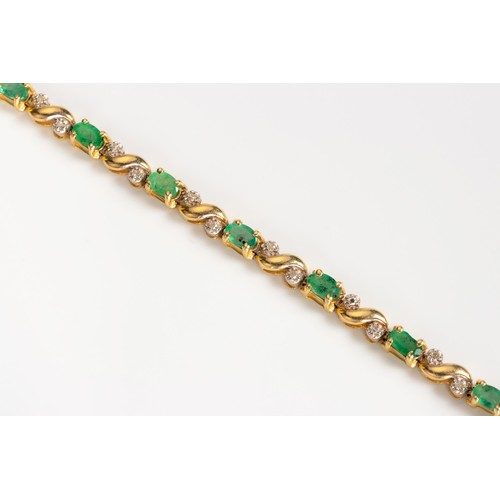 482 - AN EMERALD AND DIAMOND BRACELET