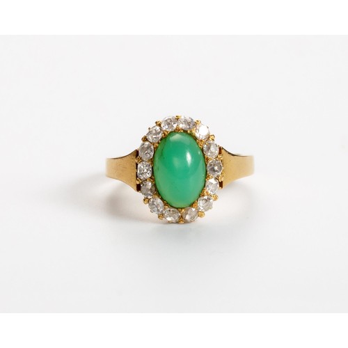 495 - A JADE-LIKE STONE AND DIAMOND RING