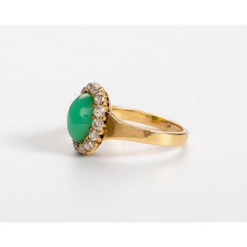 495 - A JADE-LIKE STONE AND DIAMOND RING