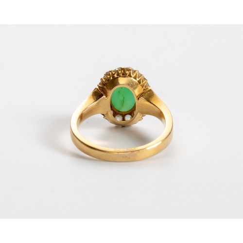 495 - A JADE-LIKE STONE AND DIAMOND RING