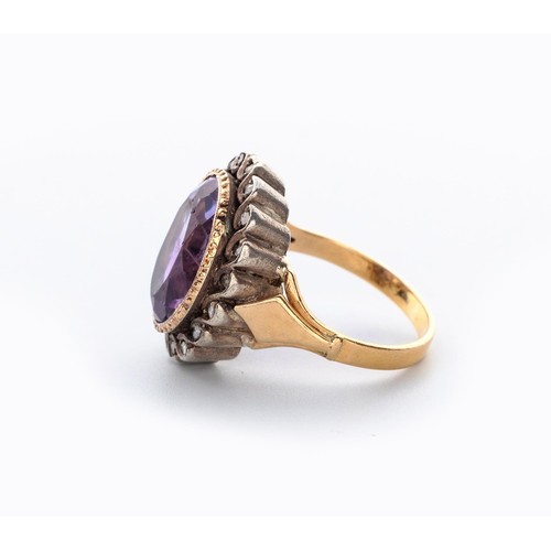 497 - AN AMETHYST AND DIAMOND RING