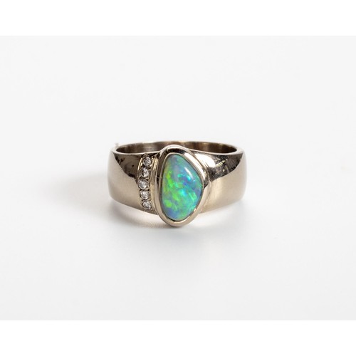 512 - AN OPAL AND DIAMOND RING, CHERRY DESIGN