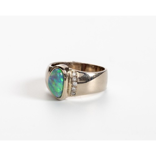 512 - AN OPAL AND DIAMOND RING, CHERRY DESIGN